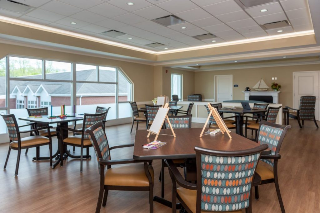 Ginger Cove Independent Living tables with easels and paint