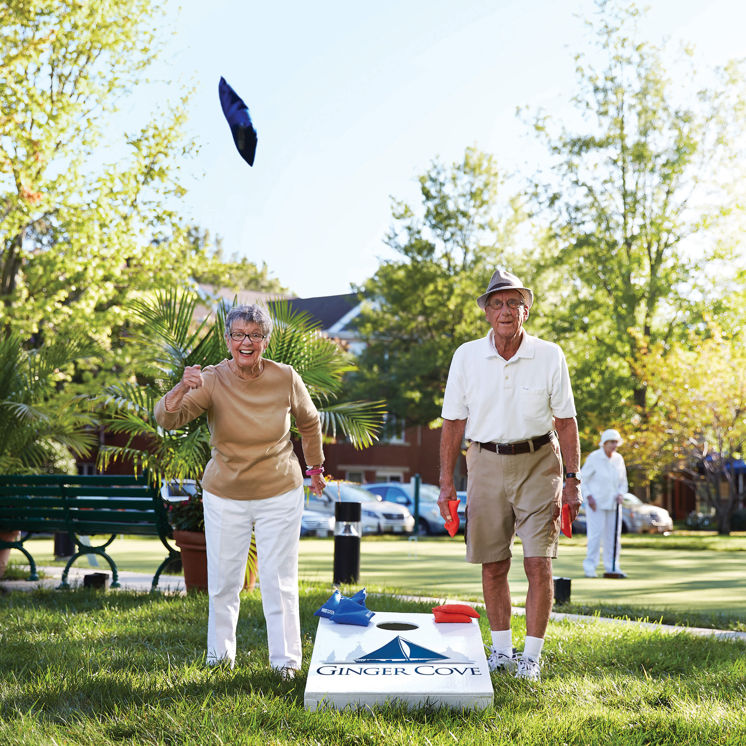 Senior couple plays corn hole at Ginger Cove