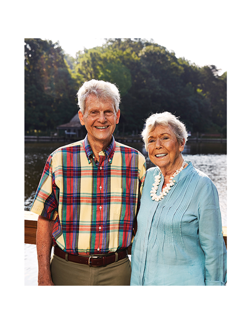 Couple smiling on Ginger Cove's dock.
