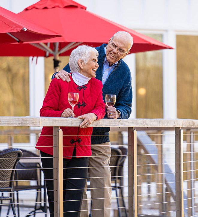 Couple enjoys one of Ginger Cove's outdoor patios. 