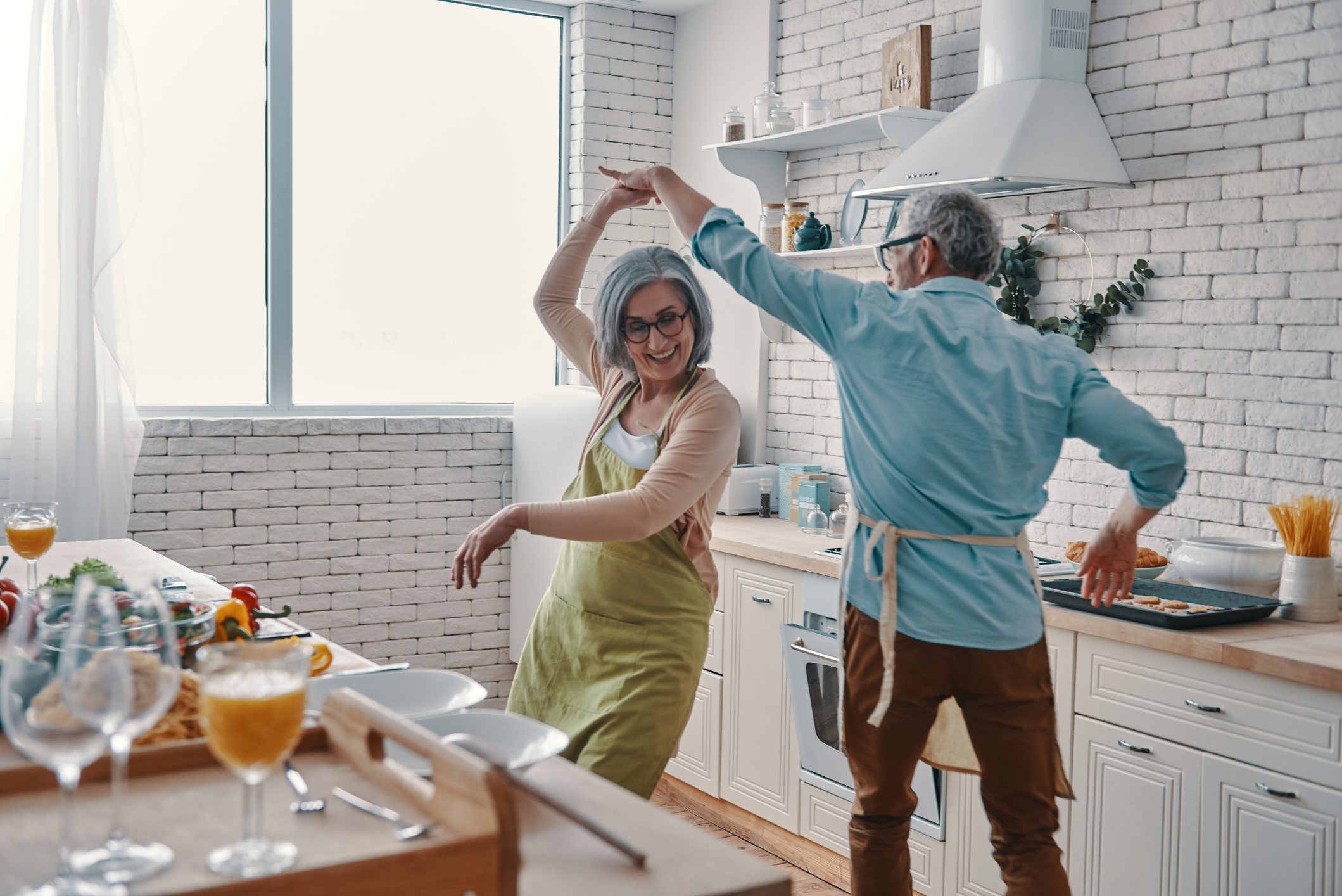 Seniors dancing in the kitchen