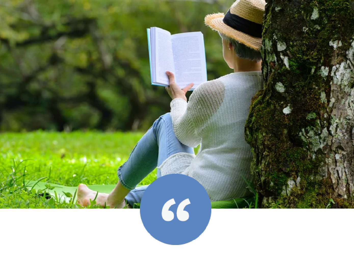 Senior reading book under tree