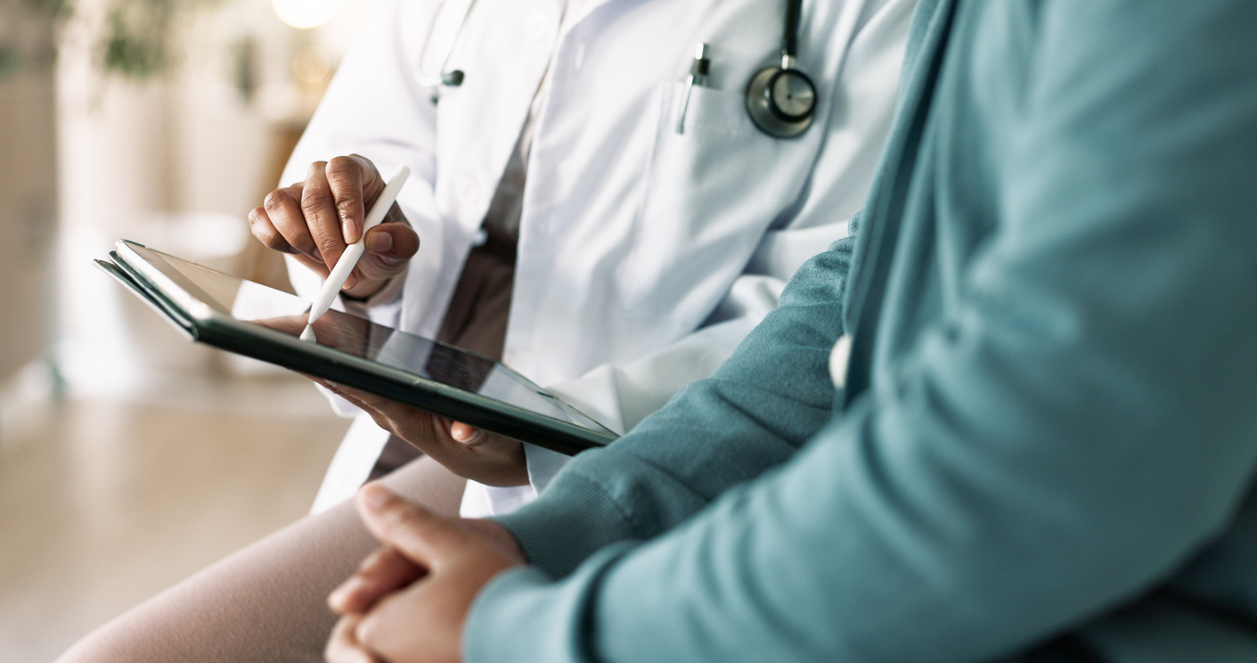Annapolis, MD Care Options for Seniors. Doctor showing patient information on tablet.