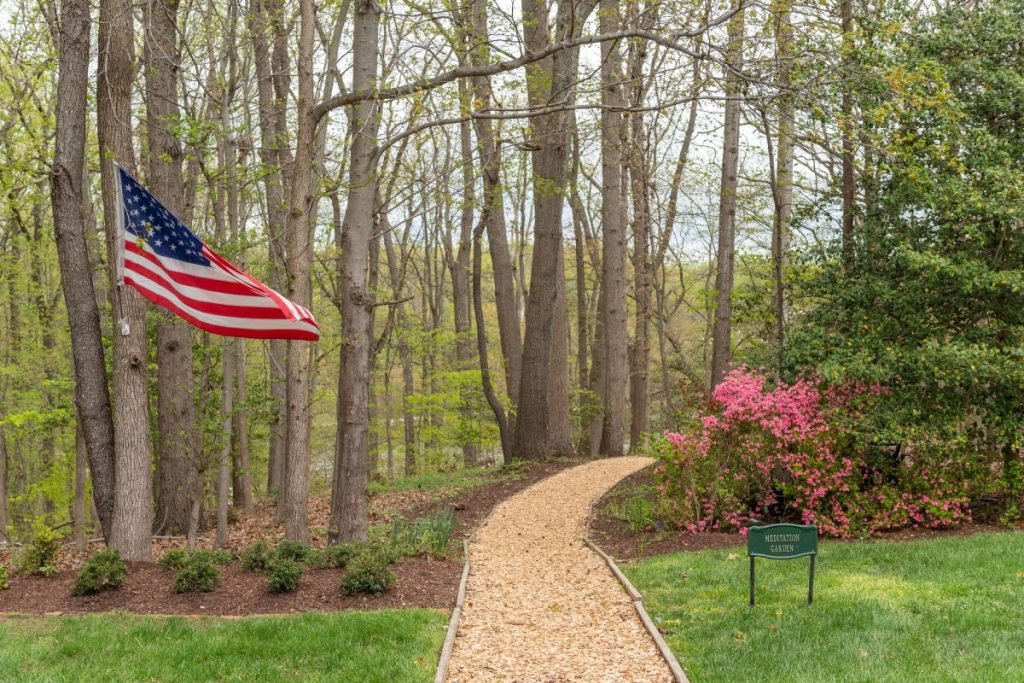 Ginger Cove walking path beside American flag