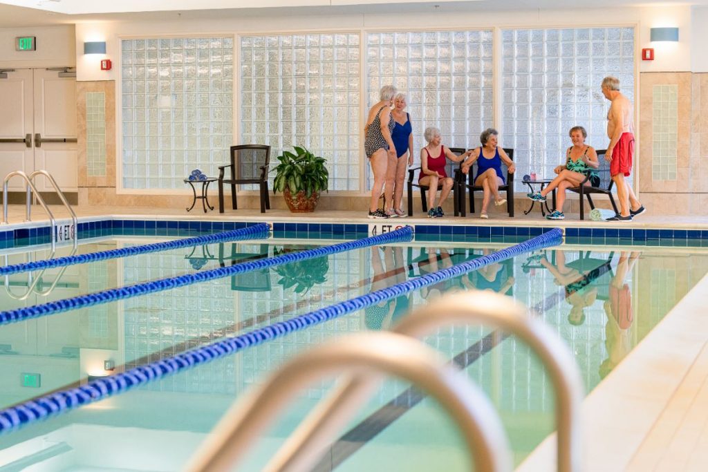 Ginger Cove residents in swimsuits at pool