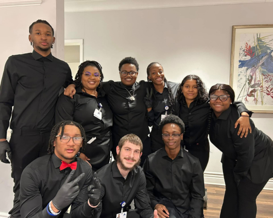 Smiling group of Ginger Cove employees