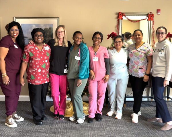 Ginger Cove nurses smiling and posing in row